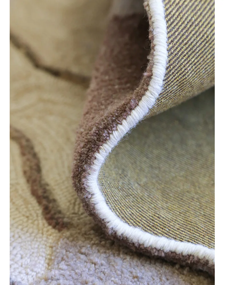 Folded edge of the Estuary rug showing the pile